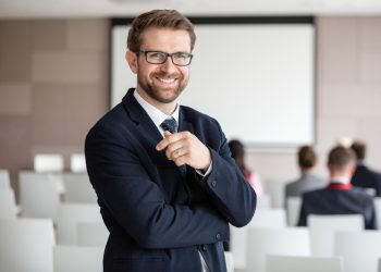 portrait-of-cheerful-young-business-man-in-office portrait-of-cheerful-young-business-man-in-office