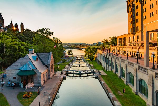 View of Downtown Ottawa overlooking the historic Rideau Canal and ByTown Museum at sunset