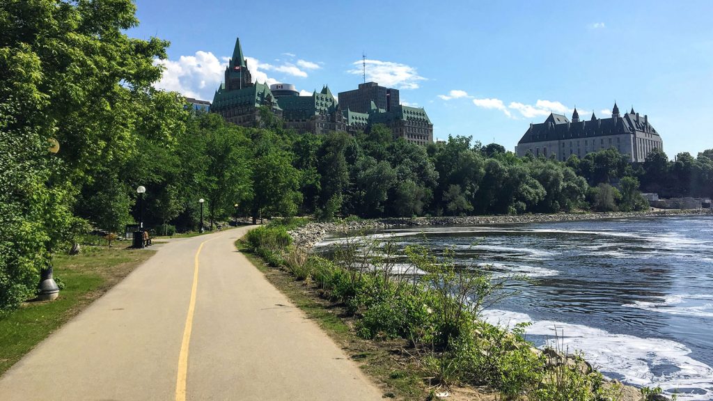 Photo of bike trail along the Ottawa River with Parliament in the background