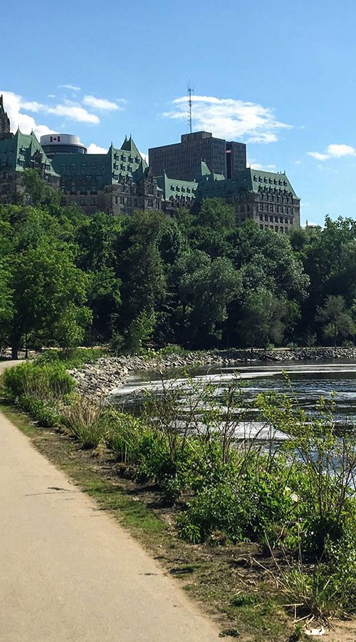 Photo of bike trail along the Ottawa River with Parliament in the background