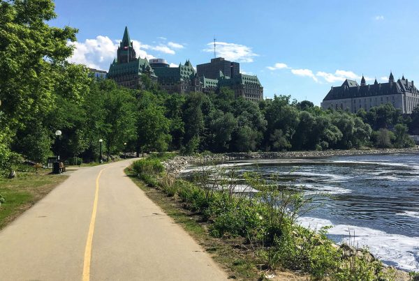 Photo of bike trail along the Ottawa River with Parliament in the background