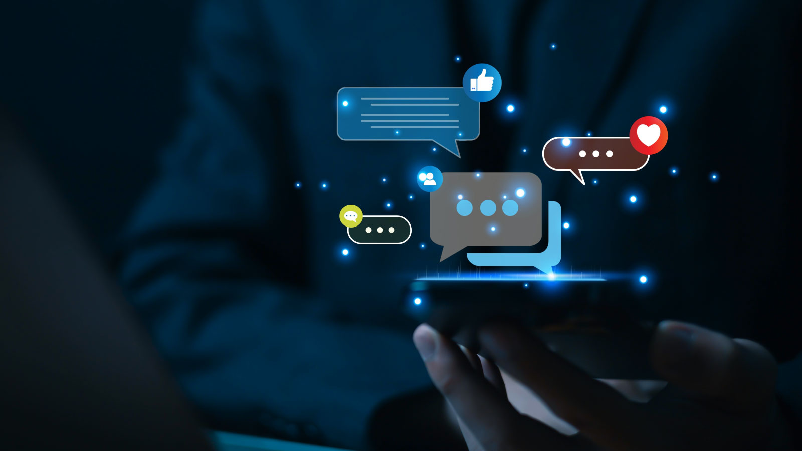 a hand holding a phone with illustrative chat bubbles popping up from the device